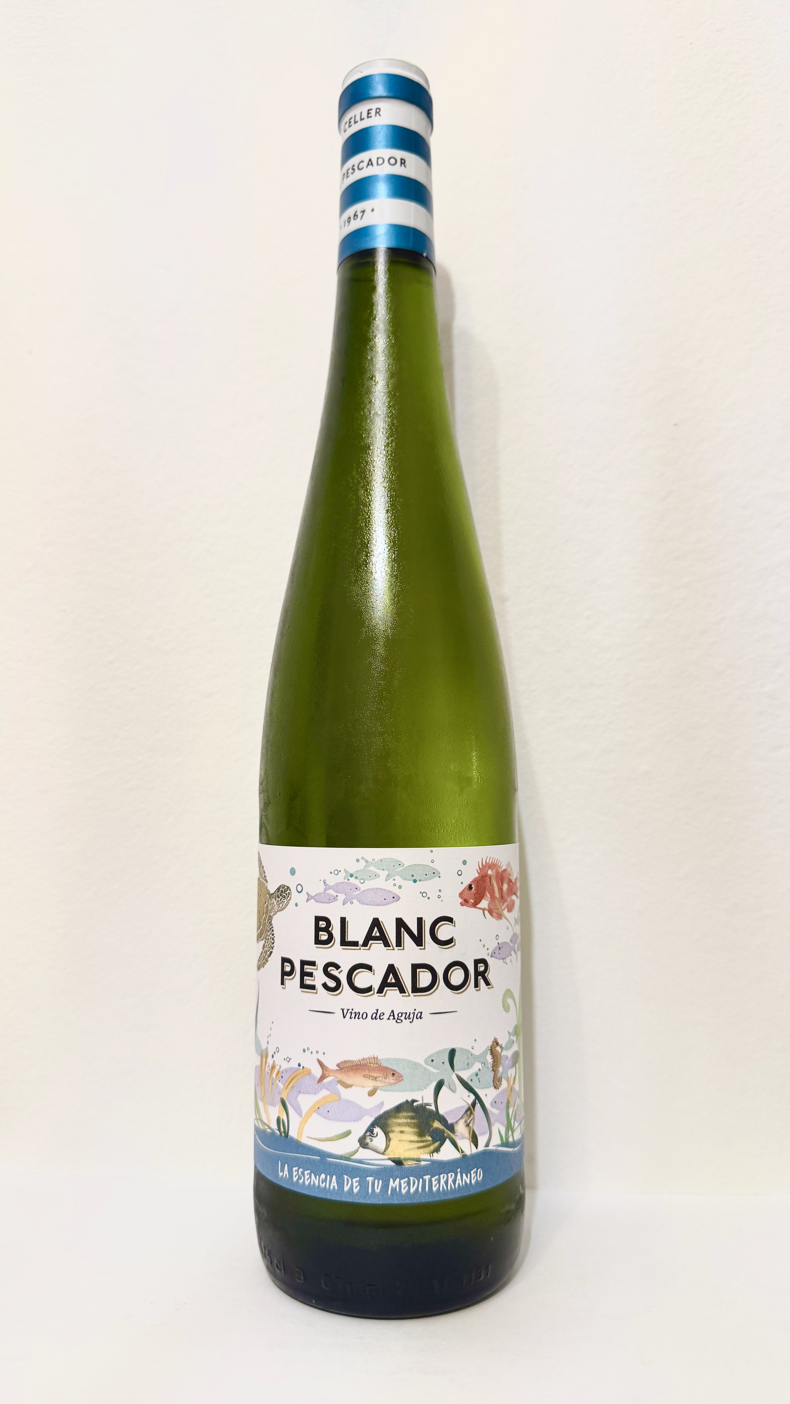 Bottle of Blanc Pescador — striped cap, illustrated fish label